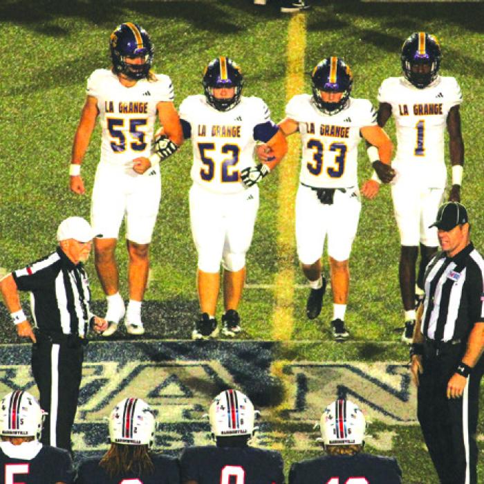 La Grange captains Shawn Skoruppa (55), Austin Williams (52), Austin Roe (33) and Thai Scott come to midfield for the coin toss. Photo by Jeff Wick