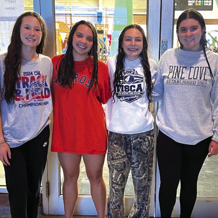 Girls’ 400 Freestyle Relay topped their early-November record in Saturday’s finals, finishing 10th with a time of 4:23.46, an improvement of 1.45 seconds. Pictured above, left to right, are Eleanor Carey, Celeine Fabre, Adysen Janacek and Madeline Willrich. Photo by Katy Michalke