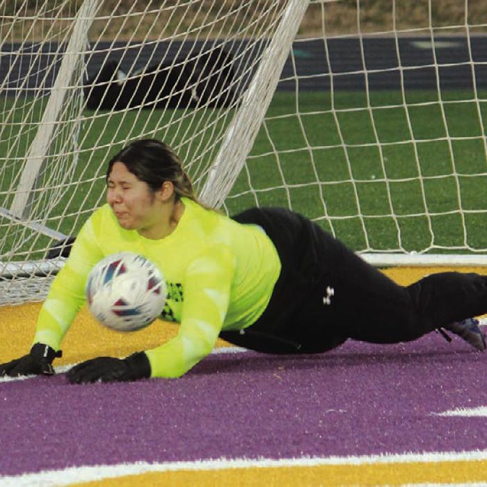 Ewalany Gonzalez makes a diving stop of a Rockdale penalty kick to help preserve the win for the Lady Leps Friday. Photo by Jeff Wick