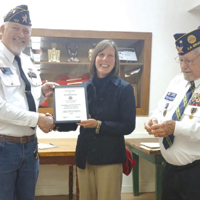 Lori receives the American Legion Gold Medal in recognition of faithful and honorable Service in the United States Army Nurse Corps. Presenting the award are Richard Gray (Post Commander) and Glenn Altwein (Past Post Commander).