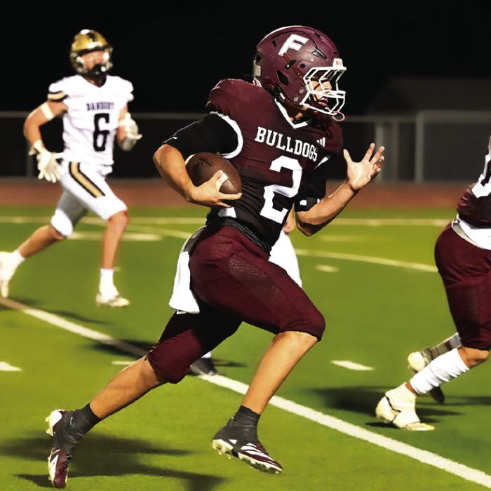 Caysen Perez (#2) heads to the end zone from the 30 yard line with 2:25 minutes left in the first half of Friday night’s district win over Danbury. Perez was the top scoring Bulldog for Flatonia on Friday night.