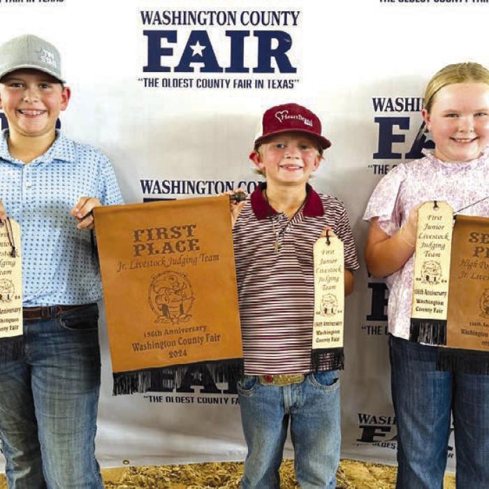 Champion Junior Team: Hudson Holub, Joseph Carrales, Abigale McBride. Not pictured: Emma Zweschper.