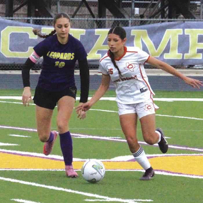 La Grange’s Trinity Yanis, left, battles for control of the ball against a Caldwell player in Friday’s match. Photo by Jeff Wick