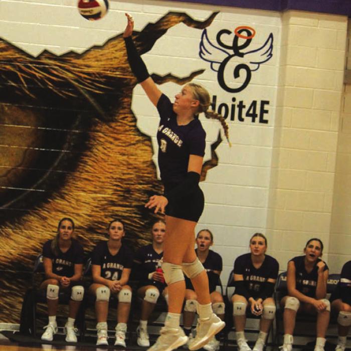 La Grange’s Carley Ulrich spikes her way to her team-high 24 kills in Friday’s victory. Photo by Jeff Wick