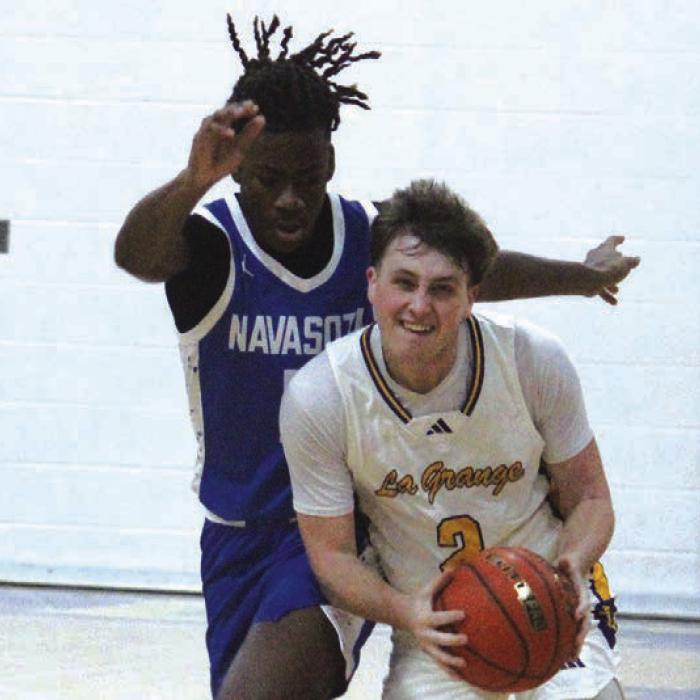 La Grange’s Caleb Norwood handles the ball Tuesday facing some tough defense from Navasota. Photo by Jeff Wick