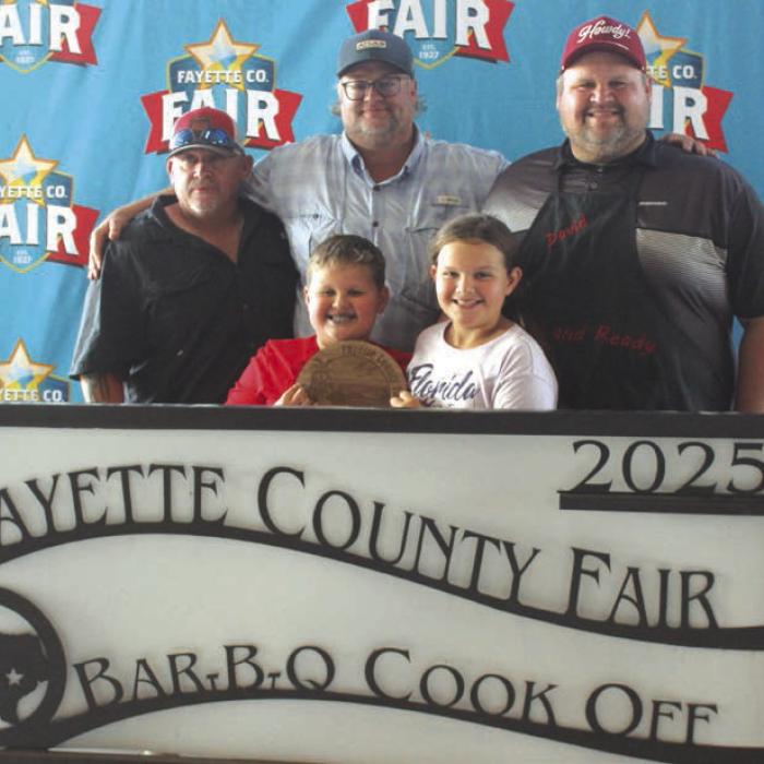 First Place Brisket – The “Good and Ready” team of, left to right, Tiger Hall, Michael Tofel and David Tofel, and front, Frank and Lillian Tofel.