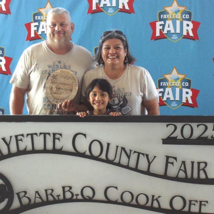 First Place Pork Ribs – The “You Kill It We Grill It” team of, left to right, Jason and Nicole Vasut and front, Reeanna Ramirez.