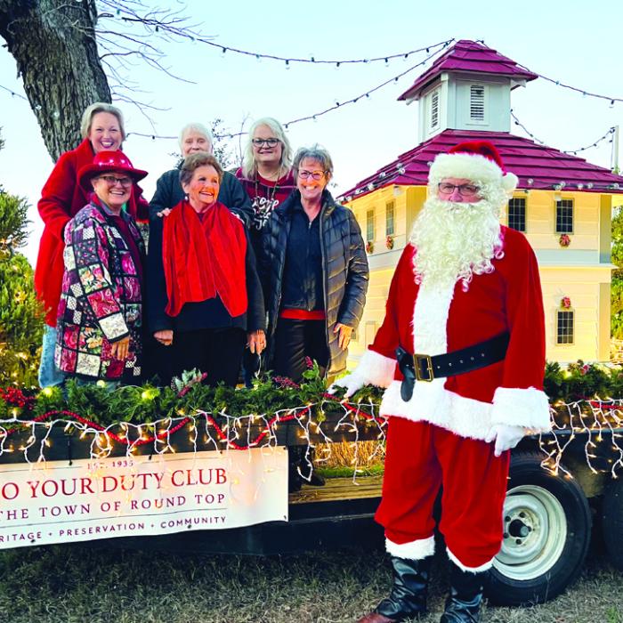 Pictured back from left: Holly Johnson, Judy Van Zandt, Dayna Davenport; front row: Debbie Koenig, Jeannette Preuss, Kathy Schatte, and Santa Claus.