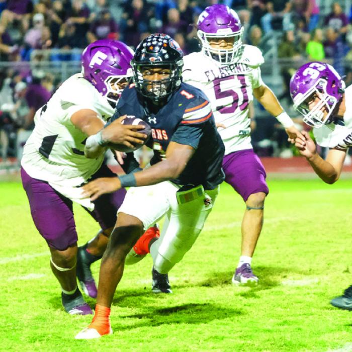 Shorthorn running back DaTerrion Houston breaks a tackle on his way downfield Friday. Photo by Andy Behlen