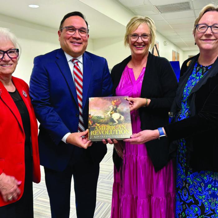 Pictured at the time of the donation are (from left) Carolyn Caflisch, Smith-McMillan Chapter Regent; John Pineda, Principal LHS; Pam Keilers, 7th-12th Grade Library Staff; and Kim Joost, Smith-McMillan Chapter Librarian.