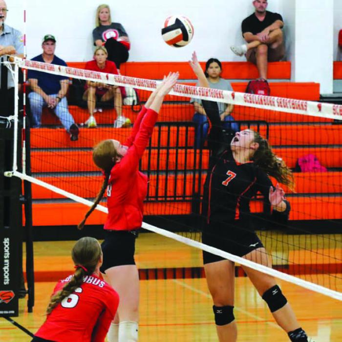 Schulenburg’s Landry Zapalac, right, battles at the net in Tuesday’s victory over Columbus. Photo by Audrey Kristynik