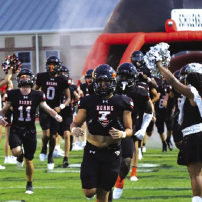 The Shorthorn run onto the field prior to Friday’s game. Photo by Audrey Kristynik
