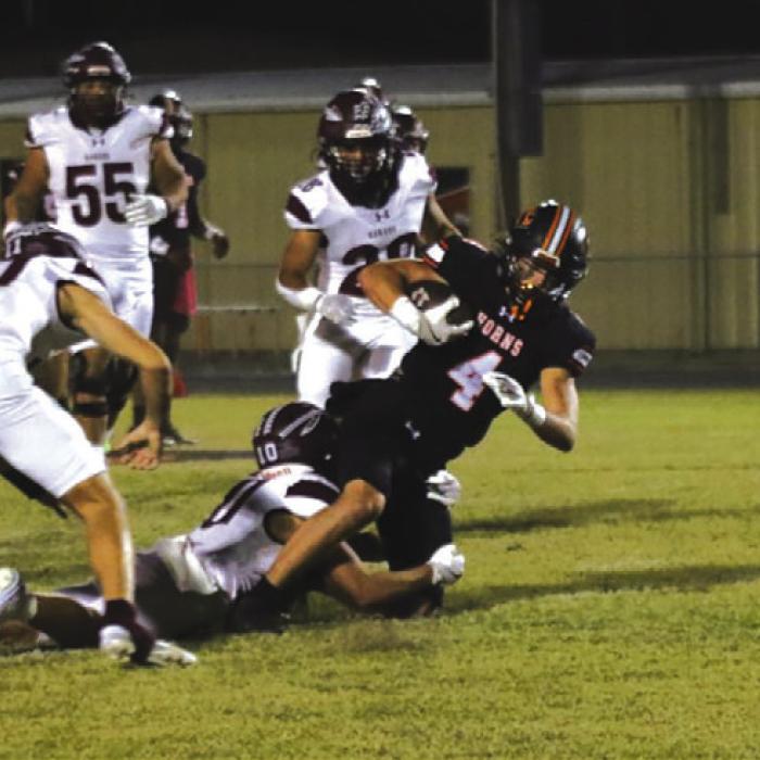 Schulenburg’s Jayse Janda fights for yardage in Friday’s game against Ganado. Photo by Audrey Kristynik
