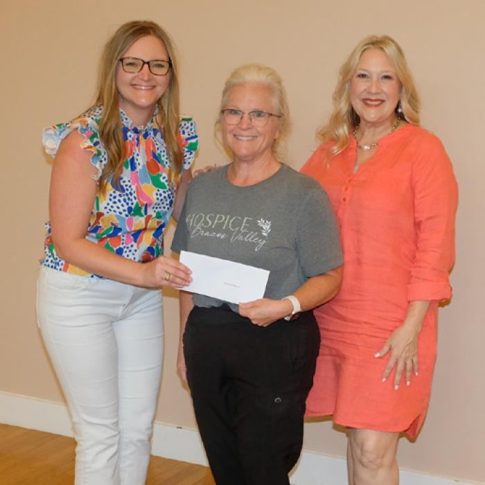 Kristen Vandever, left, presented a check to Hospice Brazos Valley, represented by Kelly Muzny and Coleen Broussard.