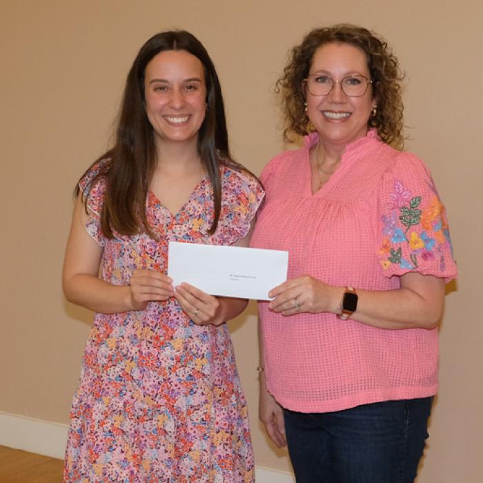 Nicole Davis, left, presented a grant check to Mt. Calvary Lutheran Church and Preschool, represented by Lori Hollek.