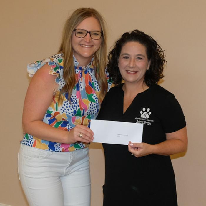Kristen Vandever, left, presented a grant check to the Gardenia E. Janssen Animal Shelter, represented by Tiffany Reid.