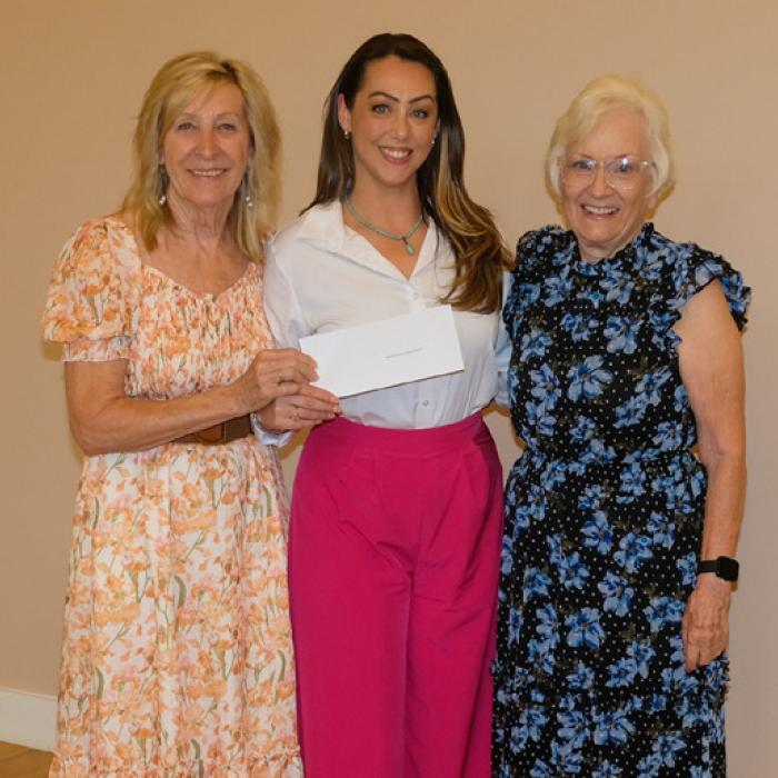 Susannah Mikulin, center, presented a grant check to the Smith-McMillan Chapter of the Daughters of the American Revolution, represented by Jackie Head and Carolyn Caflisch.
