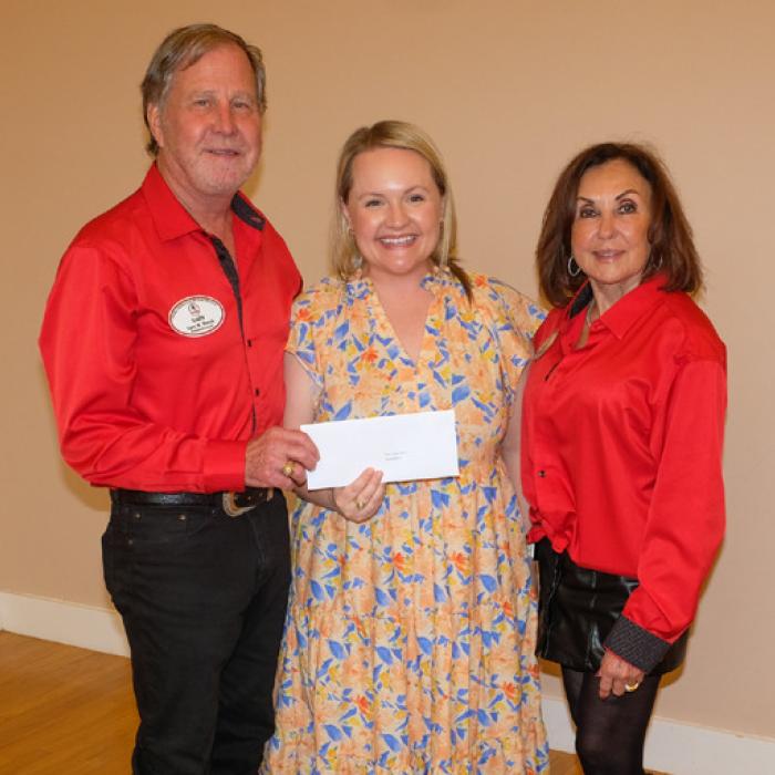 Randi Willis, center, presented a grant check to the Polka Lovers Club of Texas Museum, represented by Gary and Carol Bucek.
