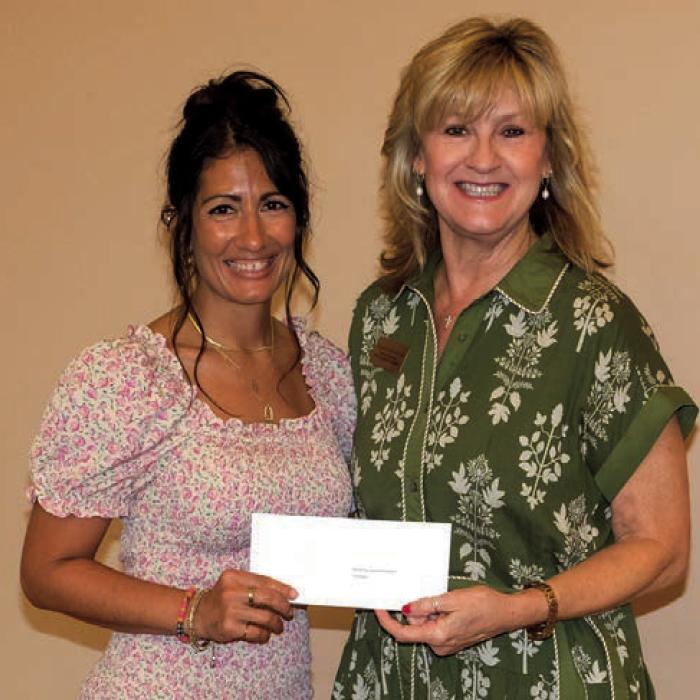Samantha Wischnewsky, left, presented a grant check to the Round Top-Carmine Education Foundation, represented by Sherry Pennington.