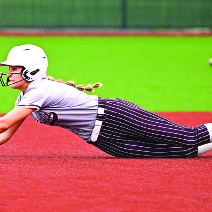 Flatonia’s Kara Croyle dives into second base on a steal in the 4th inning of play against Charlotte in the area round playoff series last week. Photo by Stephanie Steinhauser