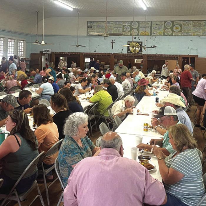 Attendees feast at the annual Ammannsville church picnic every year on Father’s Day.