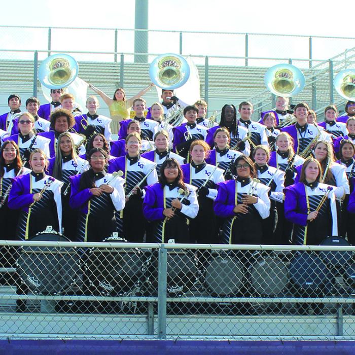 The La Grange High School band got all dressed up for their group photo day last Thursday at Leopard Stadium as they continue to prep their halftime show. This year’s halftime show is called “Flower Power” and will include vibrant pop sounds of the late 1960s and early 1970s. The drum majors this year are seniore Chloe Coufal and Kameron Behrens. Photo by Jeff Wick