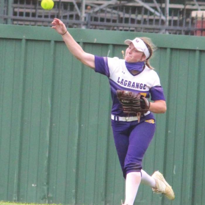 Left: La Grange’s Madison Schroeder makes a tough running catch at second base Tuesday. Right: Natalie Blackwell makes a throw from right field.