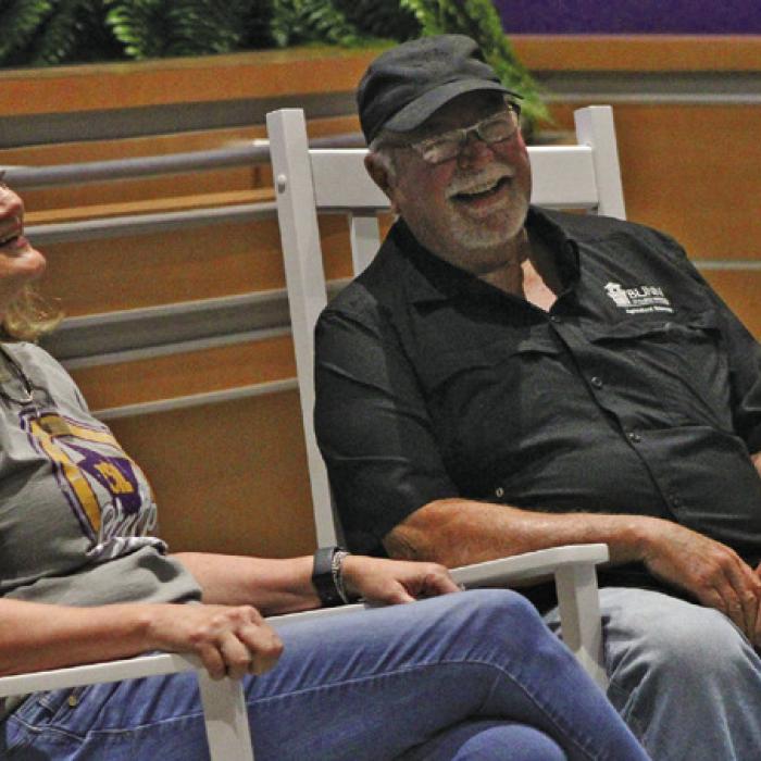 LGISD retirees Laurie Stork and Freddie Behnke were presented rocking chairs Friday at the school’s End of Year Convocation. Photo by Meadow Taylor-Marklin