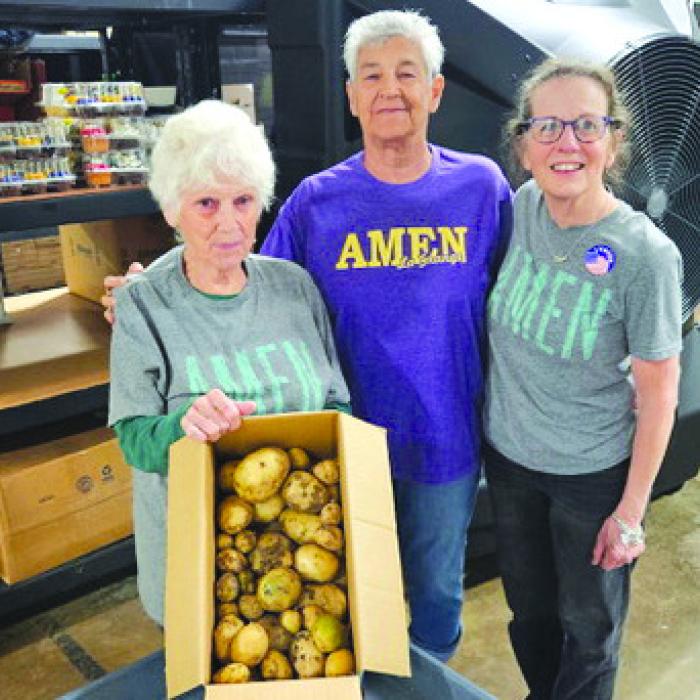 Martin Payne's donation from our community garden to AMEN received by Sharon, Janie and Susan.