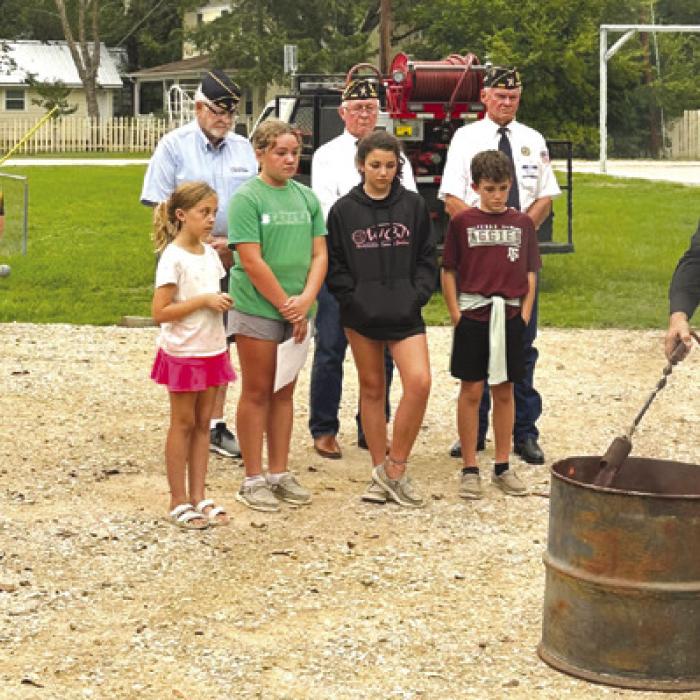 Pictured is the Flag Retirement Ceremony held at Carmine Night Out.