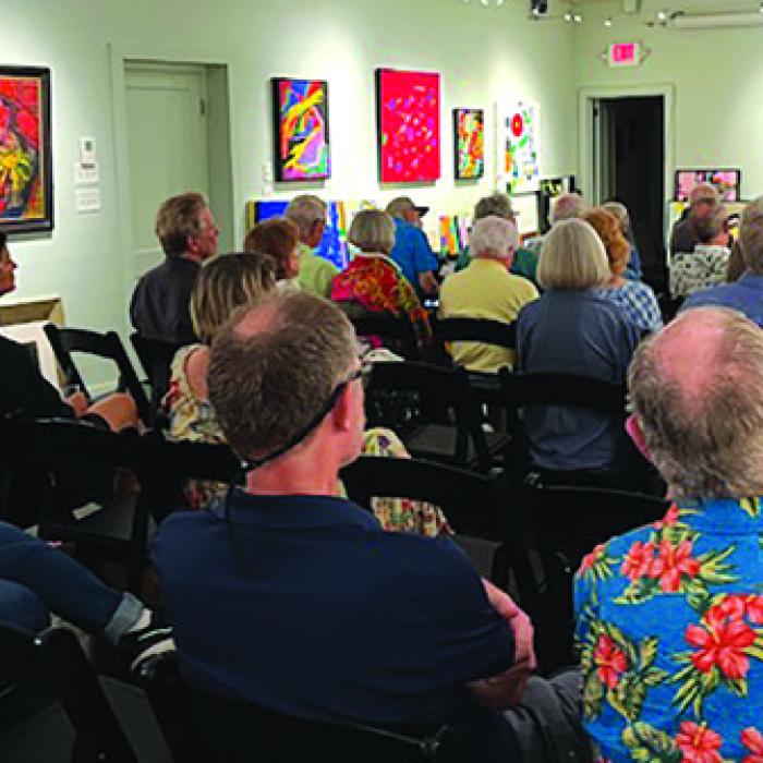 Author Joe Holley entertained the crowd at the Red &amp; White.