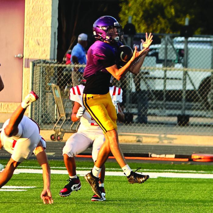 Ethan Prasek would turn this catch into the Leps’ only touchdown Friday. Photo by Darrell D. Gest