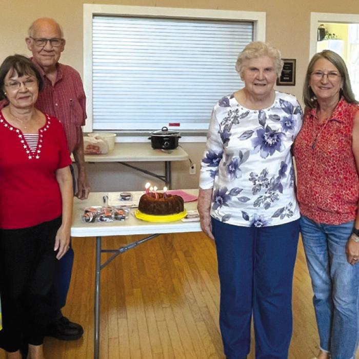 Birthday celebrants pictured left to right: Detty Danner, Phyllis Teykl, Tom Teykl, Georgia Vyvial, Vera Wehring, and Carolyn Surface.