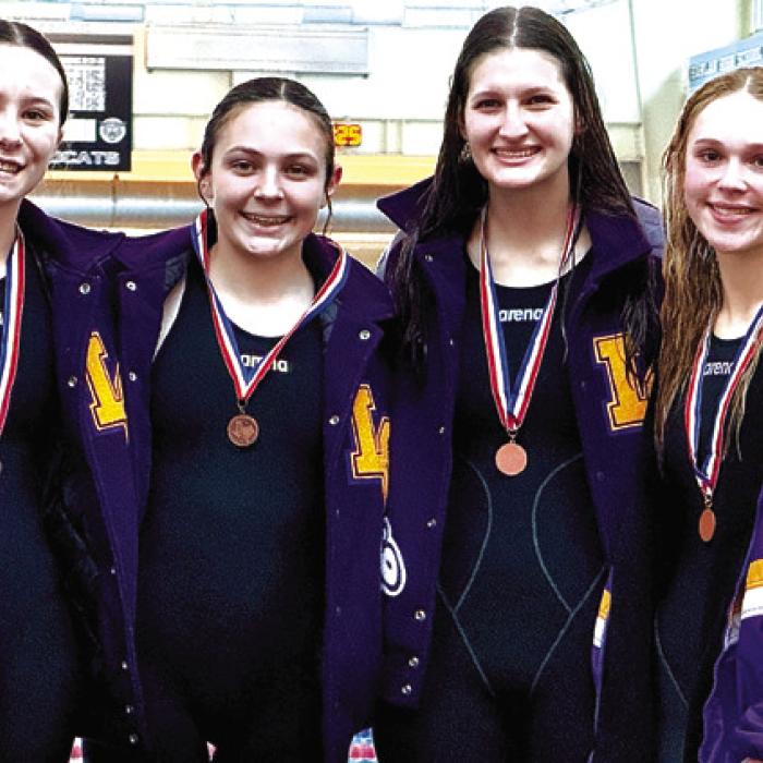 The girls’ 200 medley relay of (left to right) Eleanor Carey, Adysen Janacek, Elena Supak and Lyria Hartley, placed third while setting a new school record with a time of 2:10.79.
