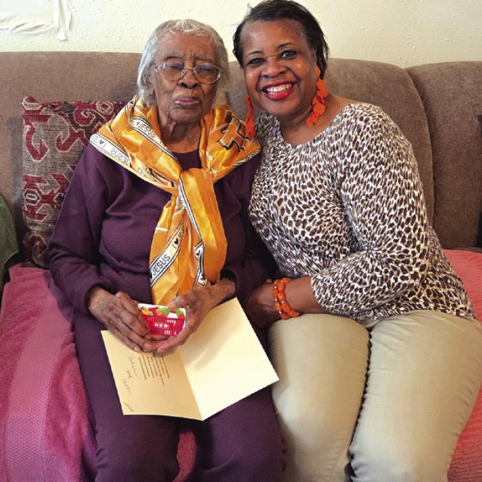 This photo shows Frances Scott, 98-years-old, left, getting a Thanksgiving Blessing gift card from Bethlehem AME Church, presented by Janette McKenzie, church secretary, right. The church gave out three other blessing cards, not pictured.