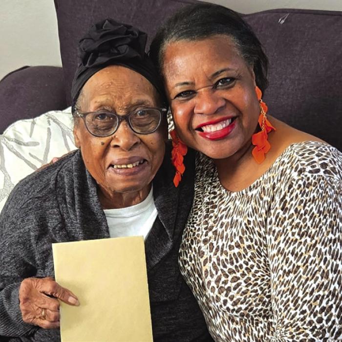 This photo shows Lovie Lee Scott, left, who turned 92 on Nov. 29, getting a Thanksgiving Blessing gift card from Bethlehem AME Church, presented by Janette McKenzie, church secretary, right.