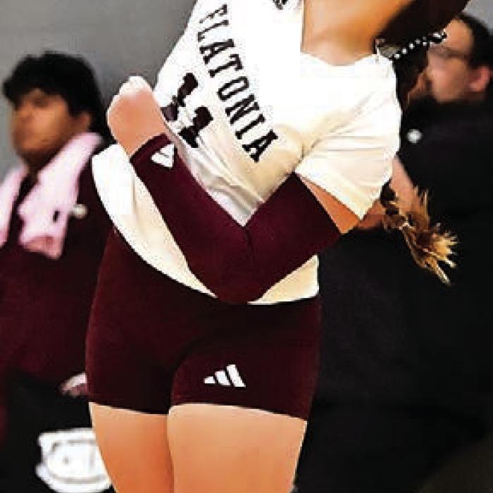 Freshman Kennedy Dornak delivers the final serve for Flatonia to pick up the winning point in the 5th set of Tuesday’s district opener versus Shiner. Photo by Stephanie Steinhauser