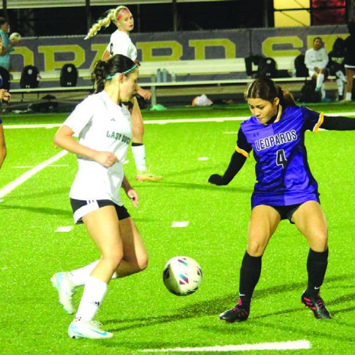 La Grange’s Miriam Lopez, right, tries to block the advance of this Taylor player Tuesday. Photos by Jeff Wick