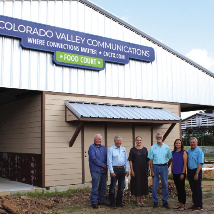 Left to right, by the new sign at the fairground food court: John Wied-Attorney, Gene Kruppa-CVCTX Board President, Karen Gunkel-CVCTX Director of Regulatory Affairs &amp; Marketing, Michal Zuhn-Fair Board President, Amber Sternadel-Customer Relations Supervisor, and Kelly Allison-CVCTX General Manager.