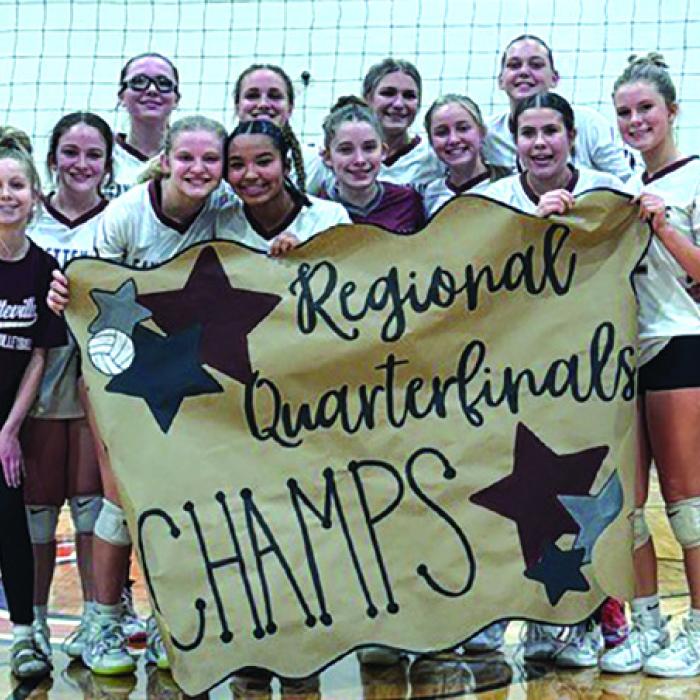 The members of the Fayetteville volleyball team celebrate their regional quarterfinal victory over Richards Thursday in Caldwell.