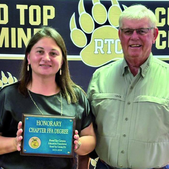 Round Top Carmine Education Foundation Board of Directors, Jackie Sacks and Ronny Sacks, accepting the Honorary Chapter FFA Degree.
