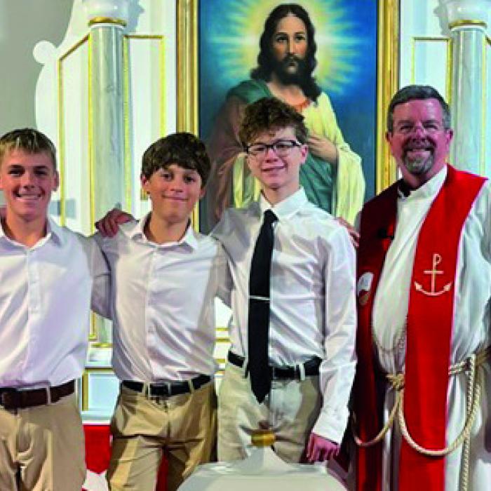 Bethlehem Lutheran Church confirmands Teague Weinert, Brenner Bishop, and Seth Kelley with Pastor John David Nedbalek.