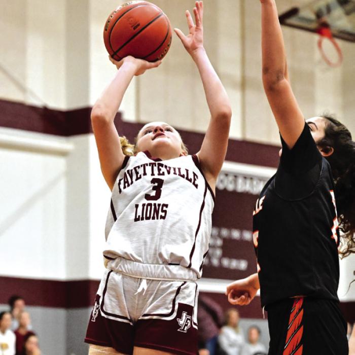 Fayetteville’s Scotti Beseda goes up for a shot in Friday’s Flatonia Tournament game against Smithville. The Lady Lions went 1-3 at the tourney, losing to Giddings, Smithville and East Bernard but beating the Victoria East JV 43-20. Paige Jurecka scored 11 points and Devynn Moeckel scored 10 in that victory. Photo by Stephanie Steinhauser