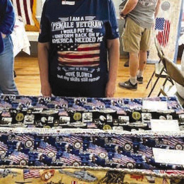 Quilter and veteran Ann Heintschel made 4 outstanding quilts for the American Legion live auction.