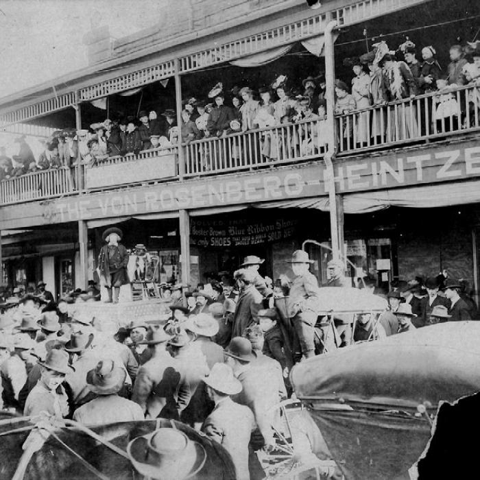 A large crowd gathered in front of the Von Rosenberg-Heintze Company at 345 and 353 West Travis Street in La Grange on March 5, 1908, to see Buster Brown and his dog pal, Tige. August Heintze is the bearded man on the balcony. Photo courtesy of the Fayette Heritage Museum &amp; Archives