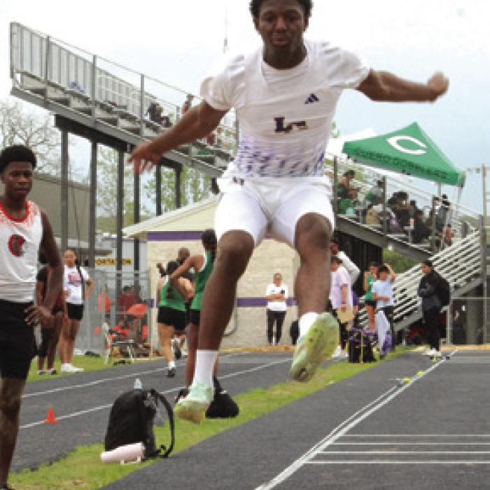 LG’s Traiton Broussard, here in the long jump, placed 2nd in the 100 meters.