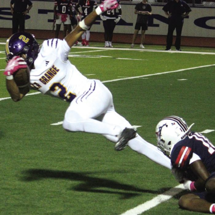 La Grange’s Dwodney Thompson tries to get free from a tackler Friday. Thompson had a huge game, scoring three touchdowns. Photo by Jeff Wick