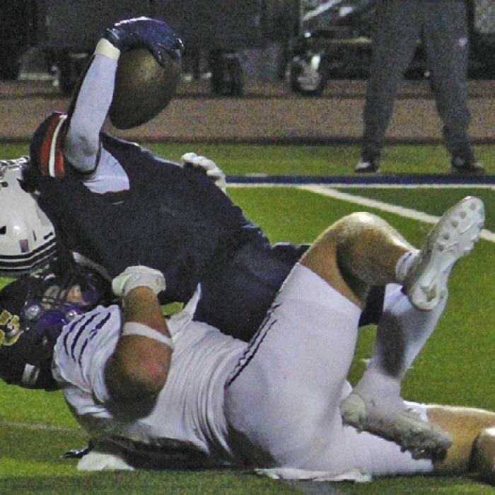 La Grange’s Oliver Gunn tackles Madisonville’s Tristan Whaley for a loss Friday. Photo by Jeff Wick