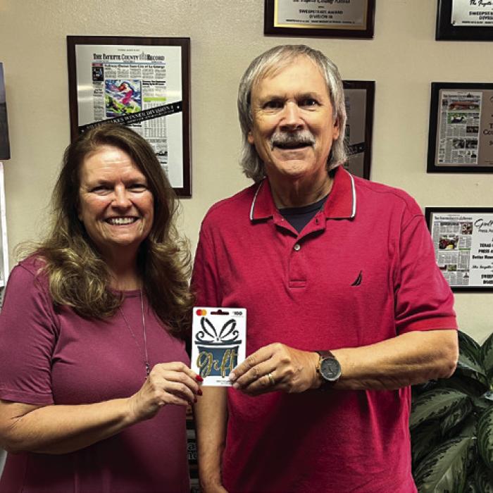 Michael Chovanec was the winner of last week’s reader football pick-it contest after correctly predicting the winners of all 10 games. He is shown here accepting his $100 gift card from Fayette County Record publisher Regina Keilers, left. The ballot appears in every Tuesday Record. Grab a copy to play.