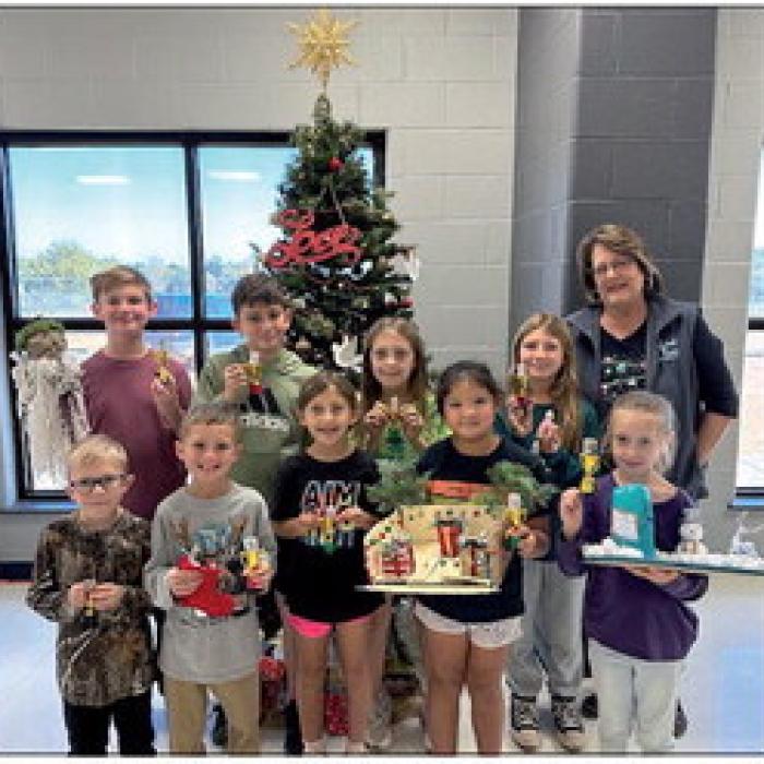 Creativity is being rewarded as these RTC students and two more were given an award for their home-made craft contest entries at the 40th Carmine Chamber of Commerce Christmas Fest on Dec. 1. Pictured are Levi Tuttle, Bowen Williams, Pyper Albrecht, Charlee Wischnewsky, Blake Bridges, Hutch Wischnewsky, Ppheya Albrecht, Maria LeBouef, Finley Martin. Not pictured are Rowdy Richards and Morgan Williams. Marlene Waak is the Chamber representative.